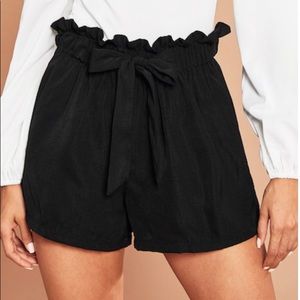 Black loose ruffle tie shorts